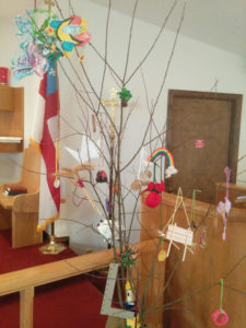 Jesse Tree decorated with symbols portraying the spiritual heritage of Jesus.